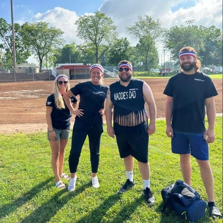Group posing happily on the ground