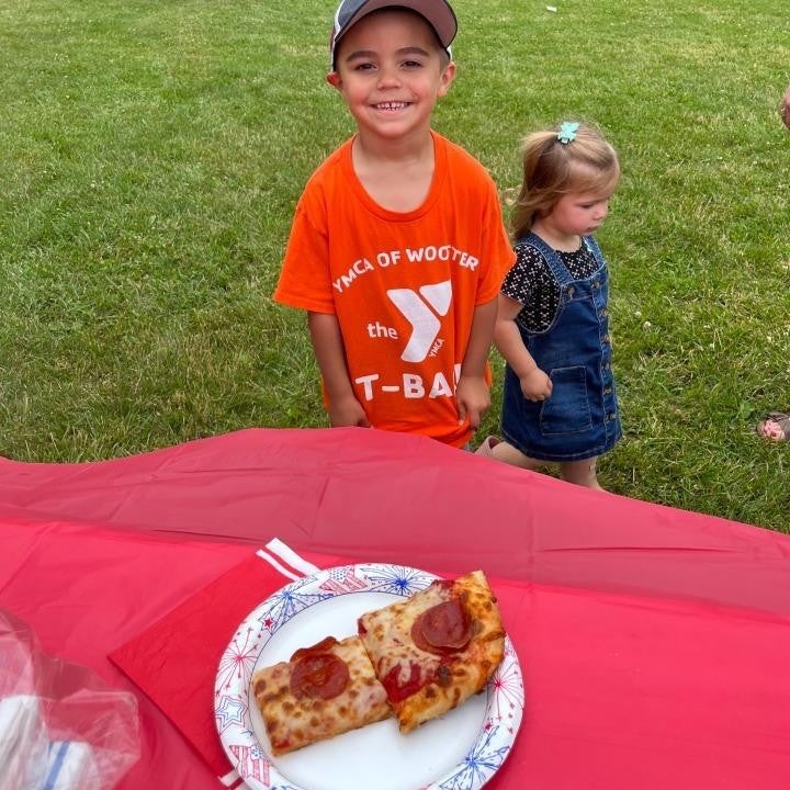 Smiling kid enjoying a meal