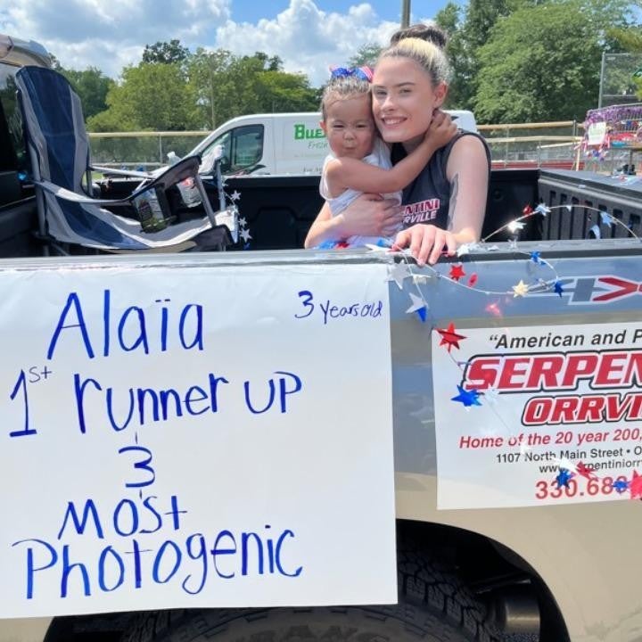 woman and girl sitting in a truck