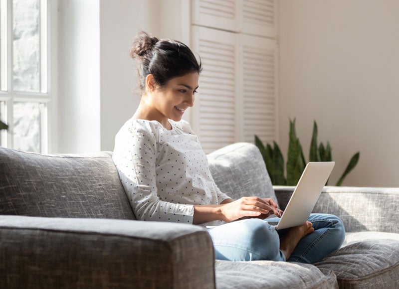 A woman shopping online for a car