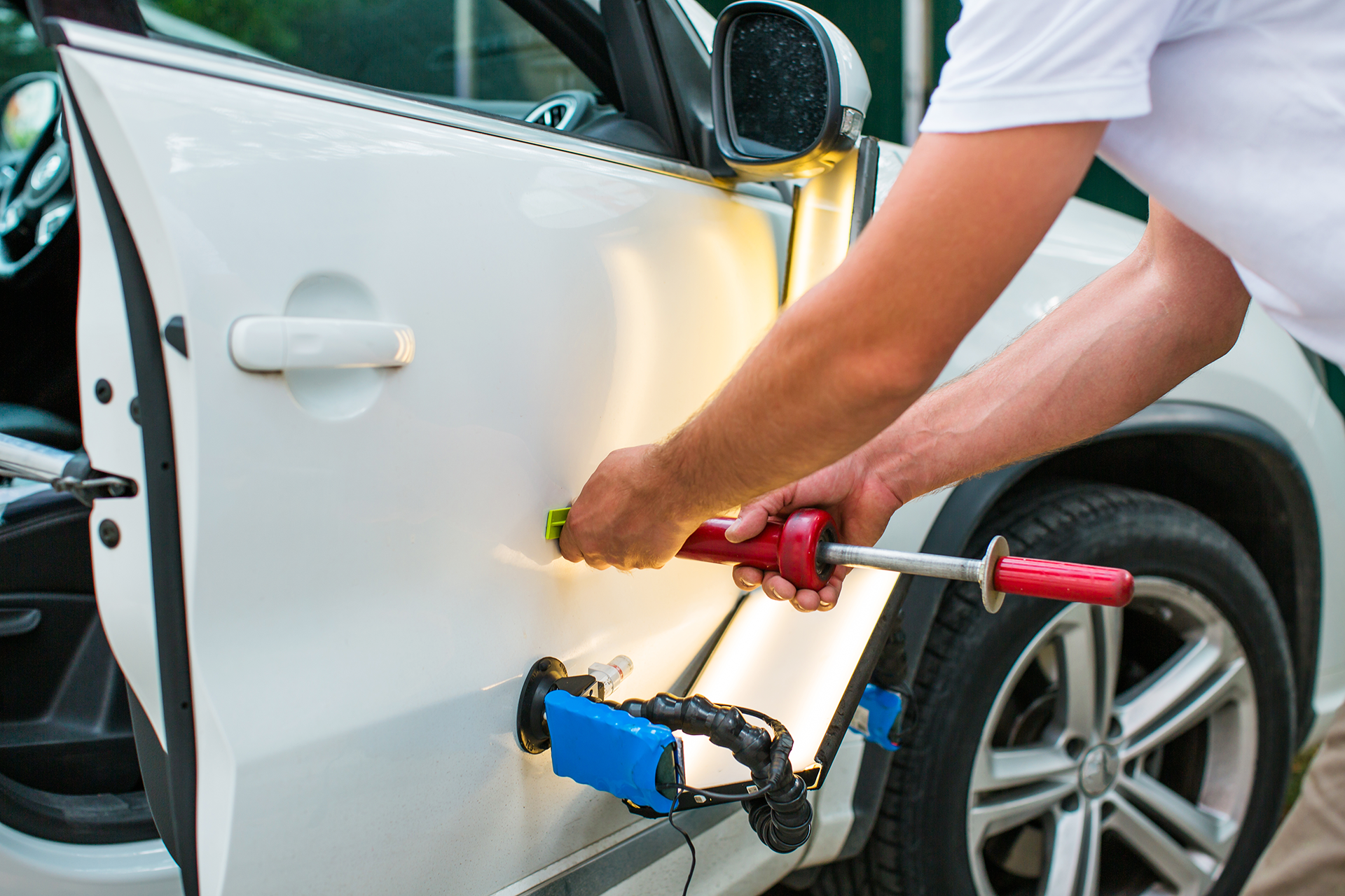 Technician expertly servicing a car